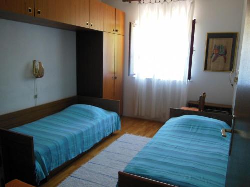 Ένα ή περισσότερα κρεβάτια σε δωμάτιο στο Apartment Jakica