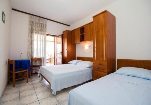 Ένα ή περισσότερα κρεβάτια σε δωμάτιο στο Apartments Juri