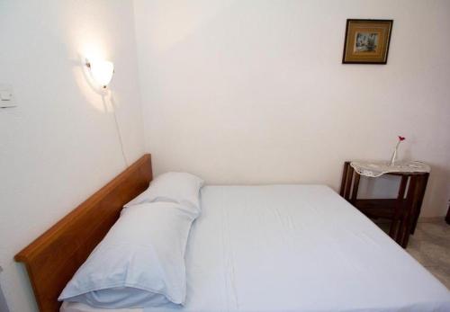 Ένα ή περισσότερα κρεβάτια σε δωμάτιο στο Apartments Juri