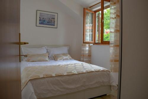 Postel nebo postele na pokoji v ubytování Apartments Daira