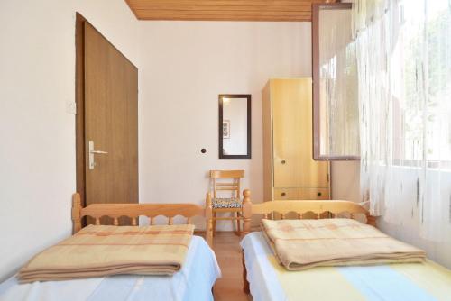 Posteľ alebo postele v izbe v ubytovaní Apartments Goran