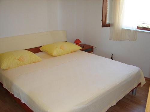 Posteľ alebo postele v izbe v ubytovaní Apartments Tone