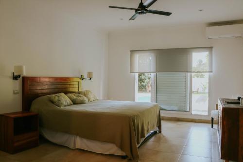 Ένα ή περισσότερα κρεβάτια σε δωμάτιο στο CASA CUTI