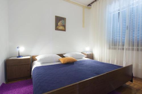 Postel nebo postele na pokoji v ubytování Apartments Vinko