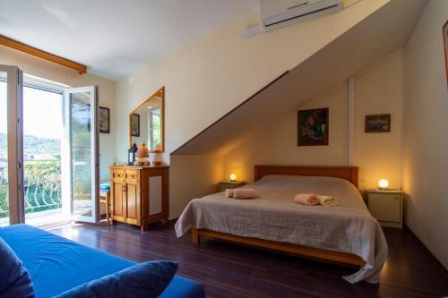 Ένα ή περισσότερα κρεβάτια σε δωμάτιο στο Apartments Mari