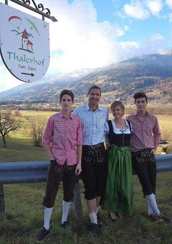 a group of people standing in front of a sign at Frühstückspension Zippo in Greifenburg