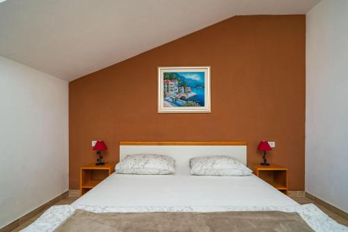 Ένα ή περισσότερα κρεβάτια σε δωμάτιο στο Apartments Pavo
