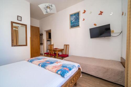 Ένα ή περισσότερα κρεβάτια σε δωμάτιο στο Apartments Pavo