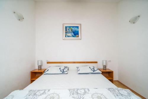 Ένα ή περισσότερα κρεβάτια σε δωμάτιο στο Apartments Pavo
