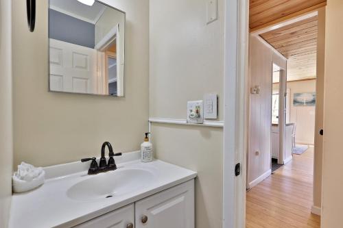 a white bathroom with a sink and a mirror at Powder Park Place- Upper Unit of Duplex - Great for Groups, Ski Rental Ticket Deals! in Killington