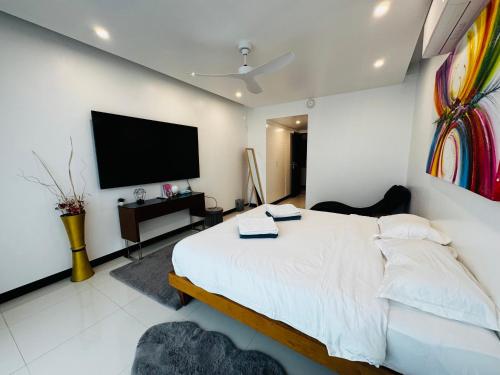 Кровать или кровати в номере The Sunrise Ocean Villa 22