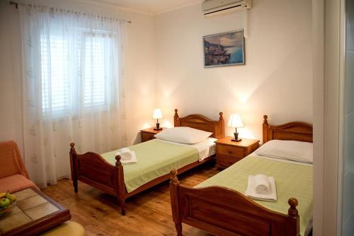 Posteľ alebo postele v izbe v ubytovaní Apartments and Rooms Robi