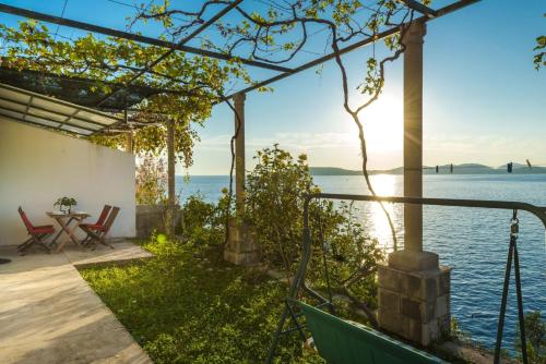 a house with a view of the water at Apartments Diana in Dubrovnik
