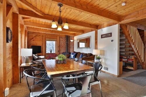 a dining room with a wooden table and chairs at The Killington Cabin - Left Unit of Duplex Home - Great for families in Killington