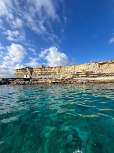 a view of the ocean from the water at Authentic Maltese Boutique Holiday Home with Rooftop Pool - Moon Townhouse in Cospicua