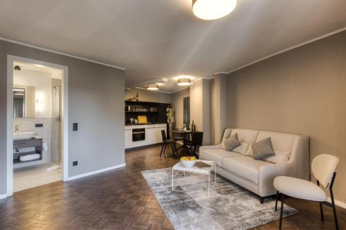 a living room with a couch and a table at Studio 9 in Fulda