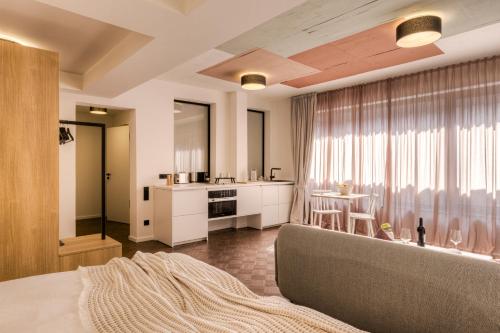 a living room with a couch and a table at Studio 9 in Fulda