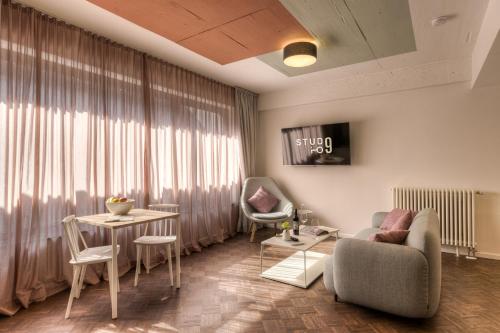 a living room with a couch and a table at Studio 9 in Fulda