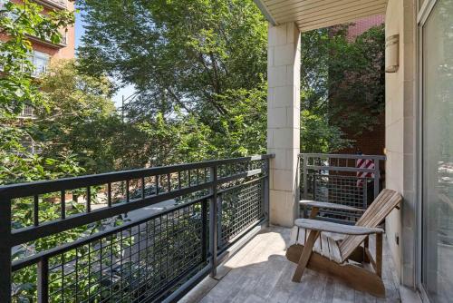 a porch with a wooden bench on a balcony at Private Balcony 1 Garage Parking Sleeps 6 in Chicago