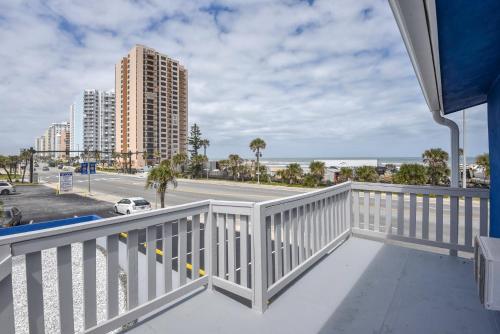 a balcony with a view of the beach and buildings at Cozy Studio Suite Near Beach W Kitchenette #11 in Daytona Beach Shores