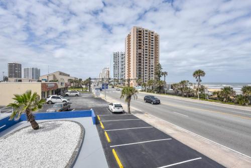 a view of a street with cars parked on the road at Cozy Studio Suite Near Beach W Kitchenette #3 in Daytona Beach Shores