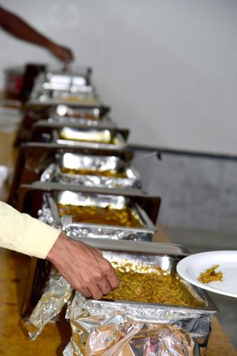 a row of trays filled with food on a table at Malra Heritage Resort Jaisalmer in Sām