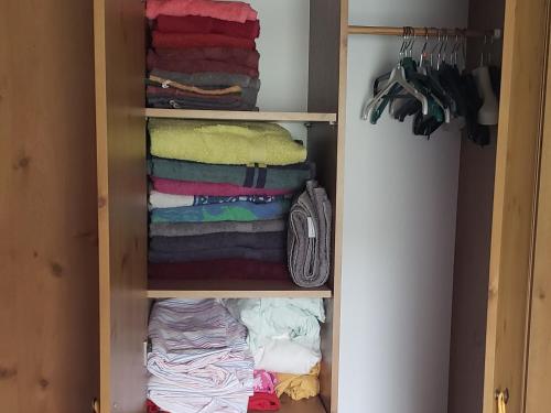 a closet filled with lots of towels and clothes at Chalet 176, Durbuy PROMO in Durbuy