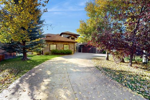 a house with a driveway in front of a house at Black Bear Lodge in Eagle