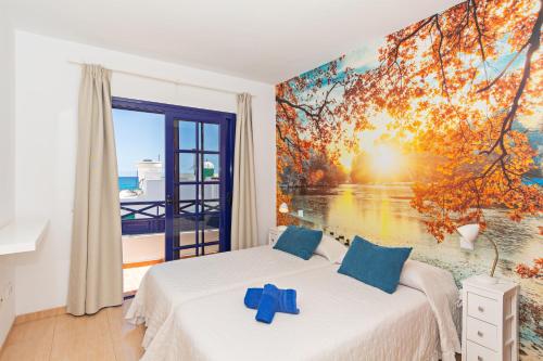 Ένα ή περισσότερα κρεβάτια σε δωμάτιο στο Apartment My Mate Playa Blanca By PVL
