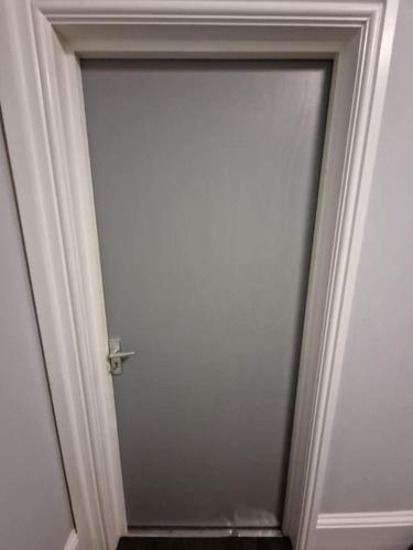 a door in a room with a white wall at Levy Nook 10 in Darlington