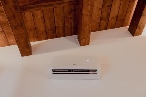an overhead view of a stove in a room with wooden walls at VicoLetto Bed and Breakfast in Laino Borgo