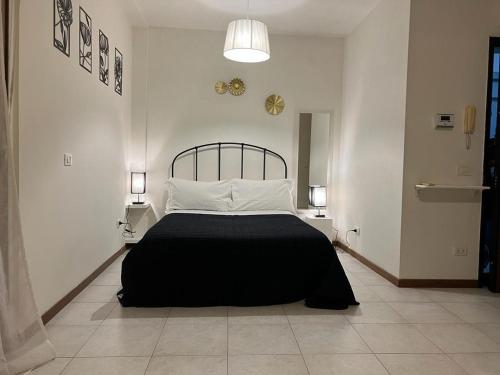 Postel nebo postele na pokoji v ubytování Arryanna Apartment