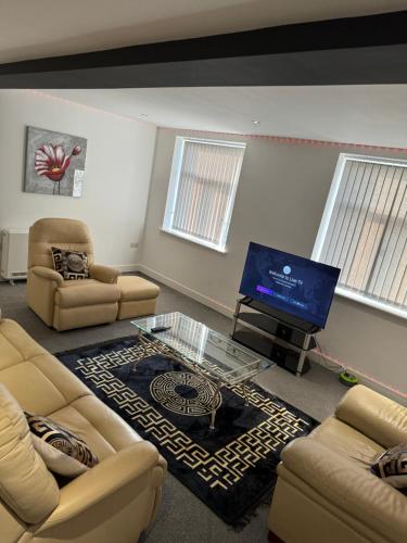 Una televisión o centro de entretenimiento en 2 Bedroom Apartment In Doncaster City Centre