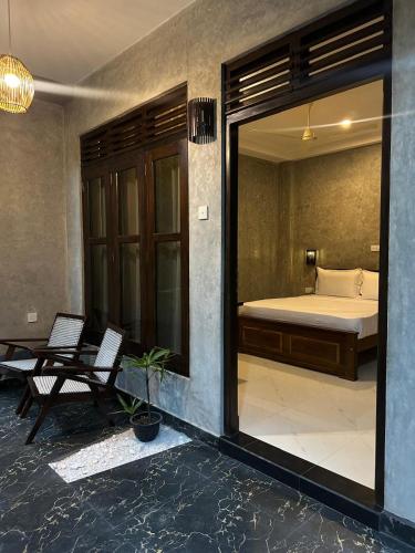 a view of a bedroom with a bed and a window at Villa Secret Stream in Mirissa
