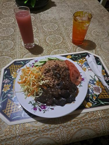 a plate of food on a table with a plate of food at Kingston Airport bed and breakfast in Kingston