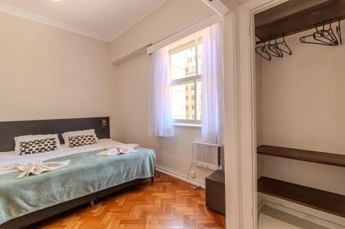 a bedroom with a bed and a window at Maroca RIO in Rio de Janeiro