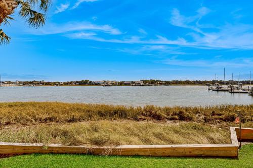 a large body of water with a dock and boats at Mariners Cay 40 in Folly Beach