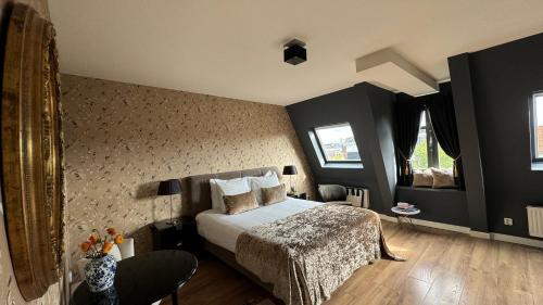 a bedroom with a bed in a room at Canal House The Tannery Amsterdam in Amsterdam