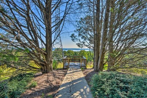 a gazebo sitting in the middle of a path between trees at Keowee Key Condo with Lake Access! in Salem
