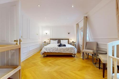 a bedroom with a bed and a table and chairs at -Air Con- Premium House - Prime location in London