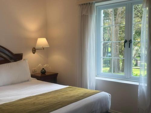 Ένα ή περισσότερα κρεβάτια σε δωμάτιο στο Parque Hotel Jean Clevers