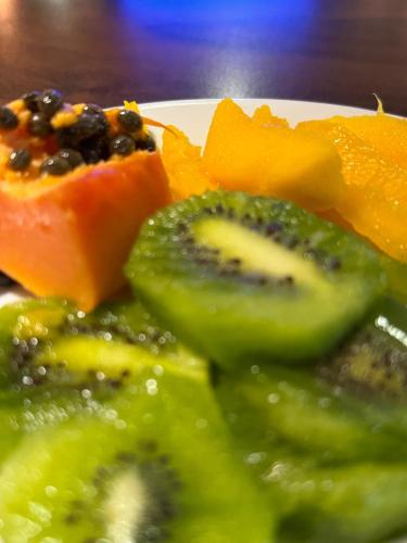 a plate of food with broccoli and other vegetables at Afford Hotéis in Lages