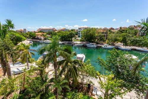 a view of a river with boats in it at Aventuras Club in Puerto Aventuras