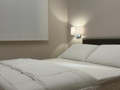 Ένα ή περισσότερα κρεβάτια σε δωμάτιο στο LA LOGGIA residenza di charme