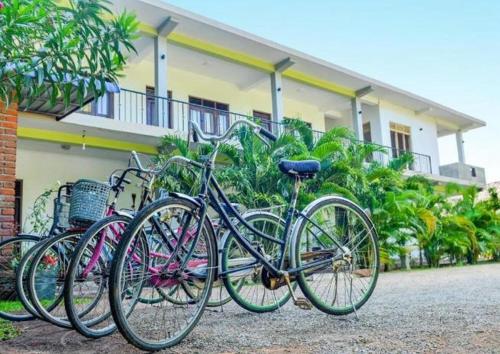 a group of bikes parked in front of a building at Ancient Village in Polonnaruwa