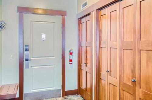 a room with a closet and a fire hydrant next to a door at Stonegate Resort Unit C202 in Big White