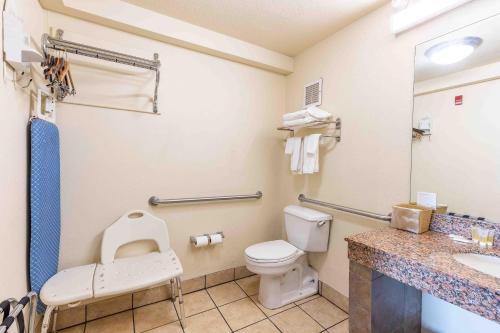 a bathroom with a toilet and a sink at Days Inn by Wyndham Oklahoma City/Moore in Oklahoma City