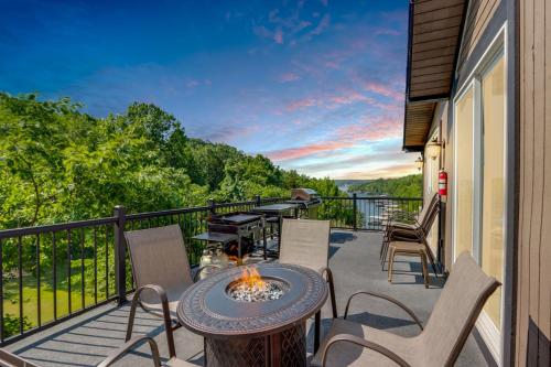 a balcony with a table and chairs and a grill at Lake-View Osage Beach Resort Home with Game Room! in Osage Beach