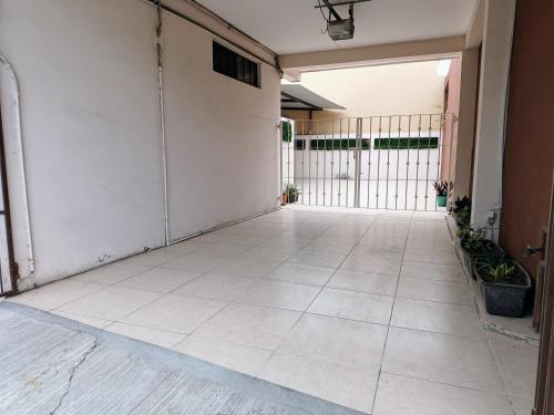 an empty hallway of a building with a gate at Departamento México in Tampico