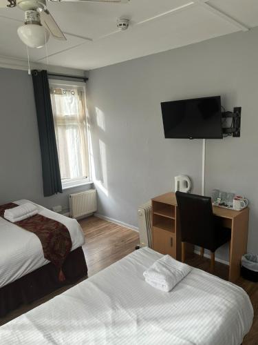 Ένα ή περισσότερα κρεβάτια σε δωμάτιο στο Ruxley Rooms